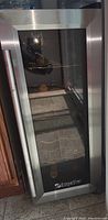 Full front view of Edgestar wine cooler with closed tempered glass door and stainless steel frame.