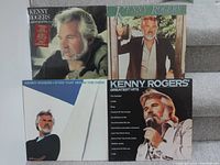 Photo showing 4 Kenny Rogers LP vinyl record covers arranged in a grid