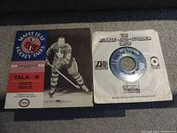 Photo of Maple Leaf Hockey Talks Talk #8 Eddie Shack 12-inch record sleeve with promotional info and the 45 RPM single in white paper sleeve