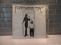 Front cover of Fleetwood Mac self-titled vinyl LP showing black and white photo of two men and band name.