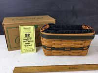 Box labeled "Collectors Club" with the 1997 Renewal basket beside it, showing basket size and lot card.