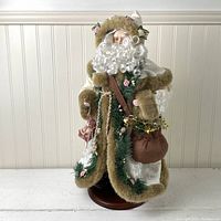 Front view of the Victorian Santa figurine showing intricate clothing details and accessories.