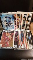 Stack of 38 Legion comic books showing front covers with various characters and designs.