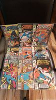 Full grouping of nine Speedball comic books arranged on floor, showing front covers with colorful Marvel comics artwork