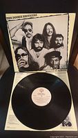 Front cover of "Minute by Minute" album showing black and white photo of the band members