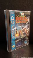 Front side of the Star Wars Rebel Assault Sega CD game case showing cover art and Sega CD branding.