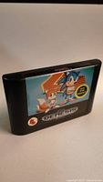 Front angled photo of Sonic 2 Sega Genesis cartridge showing full label featuring Sonic and Tails with 2 player notice