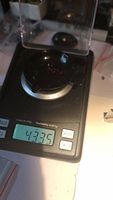 Garnet gemstones weighed on digital scale showing total weight of 4.33 carats.