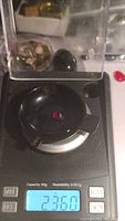 Image of the ruby gemstone on a scale showing weight of 2.36 carats.