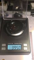 Photo of a digital scale weighing the garnet parcel with a reading of 3.95 carats.