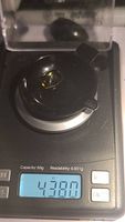 Close up of digital scale showing gemstone weight 4.38 carats