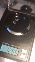 Two faceted blue topaz gemstones placed on a digital scale showing 3.29 carats total weight.