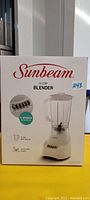 Front of Sunbeam blender box showing brand, model, and key features such as 5-cup capacity and 5-speed plus pulse settings.