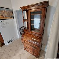 Angled left-front view of closed cylinder desk and bookcase top