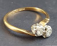 Front angle showing both diamond mounts and yellow gold band