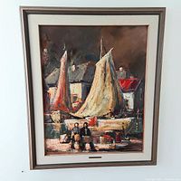 Frontal view of framed oil painting showing North Africa harbor scene with sailboats, houses, two figures at dock. Brass plaque below painting.