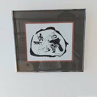 Full view of framed print hanging on wall