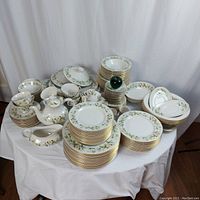 Wide view of entire 100-piece set arranged on table