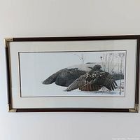 Full view of framed print depicting a bird in winter landscape