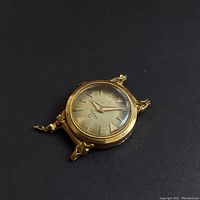 Watch head on black background, case and dial visible