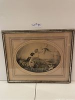 Framed art print with oval mat and PetsNote watermark on mat