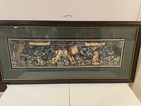 Full view of the framed William Morris print with dark wood frame and green matte.