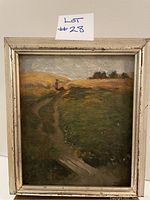 Frontal view of the framed oil painting depicting a grassy landscape with path and figure
