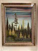 Full view of the framed forest landscape painting signed by Erle Carter Thomas, showing overall condition and frame wear.