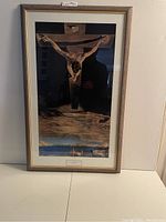 Full view of framed Salvador Dali print, Christ of St. John of the Cross, showing subject and frame.