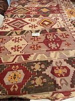 Top view of vintage kilim rug showing patterns and colors