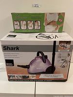 Photo of Shark Steam Blaster and V Shaper boxes stacked showing packaging and branding