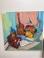 Front view of oil painting showing guitar, trumpet, French horn, music sheet, and chair.