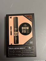 Front view of unopened Browfix Sculpt & Define Brow Kit box showing contents and kit details in medium brown.