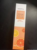 Box of Moira Citrus Blossom Hand Cream with citrus fruit graphics, unopened.
