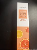 Photo of unopened Moira Citrus Blossom Hand Cream rectangular box showing citrus design and product text.