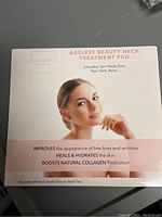 Front of retail box with product branding, model photo and key benefits including wrinkle improvement, hydration, and collagen boosting.