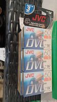 Three-pack JVC MiniDV blank digital video cassettes, sealed in original packaging with 60-minute duration tapes visible.