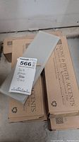 Four boxes of Stone & Pewter Accents Lunada Bay Tile with one tile displayed showing gloss finish and size 3x9 inches.