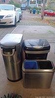 Photo showing all three waste baskets side by side, two taller bins and one shorter bin on the right.