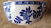 Close-up of blue floral design detail on the sugar bowl.