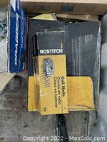 Two boxes of Bostitch coil nails, in original packaging.