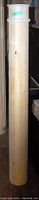 Tall wooden column with decorative band at top, smooth surface with visible wood grain and natural marks
