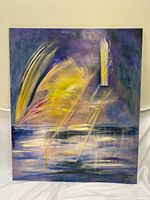 Full view of the colorful abstract canvas painting showing vibrant colors and abstract shapes.