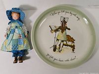 Holly Hobbie doll and matching collector's plate side by side