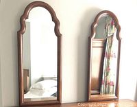 Two mirrors side by side on dresser showing overall size and matching frames