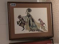 Framed illustration showing a robed figure and two smaller characters in costume