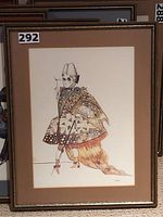Full view of the framed costume illustration featuring a figure in an elaborate 18th-century style costume with geometric patterns and a powdered wig.