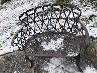 Front view of settee on snow-covered patio