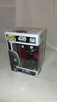 Front and angled view of the boxed K-2SO Funko Pop! vinyl figure from Star Wars Rogue One, showing the figure and packaging made of cardboard and clear plastic.