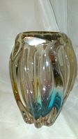 Front view of vintage Narumi hand blown art glass vase showing the multi-faceted curved sculptural form with smoky color and clear glass.
